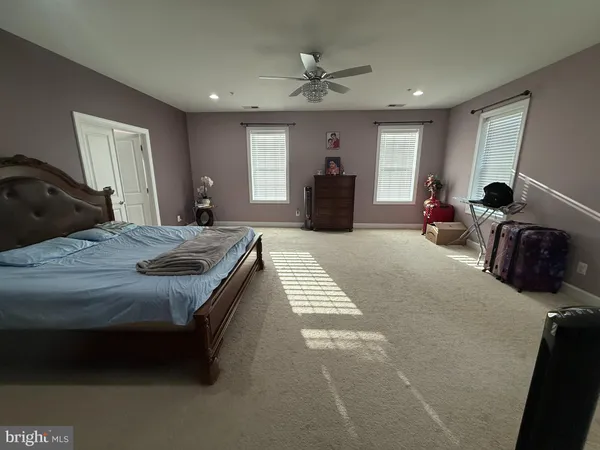 a bedroom with bed and window