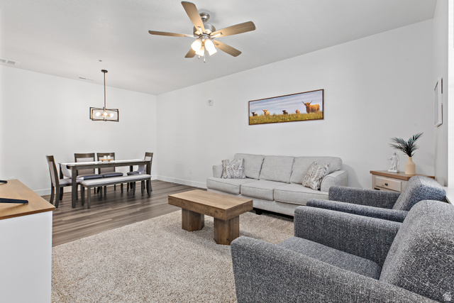 4735 Alder Drive, Unit F101 Mapleton, UT 84664 - Photo 7 of 30 Living room featuring a ceiling fan and dark wood-style floors