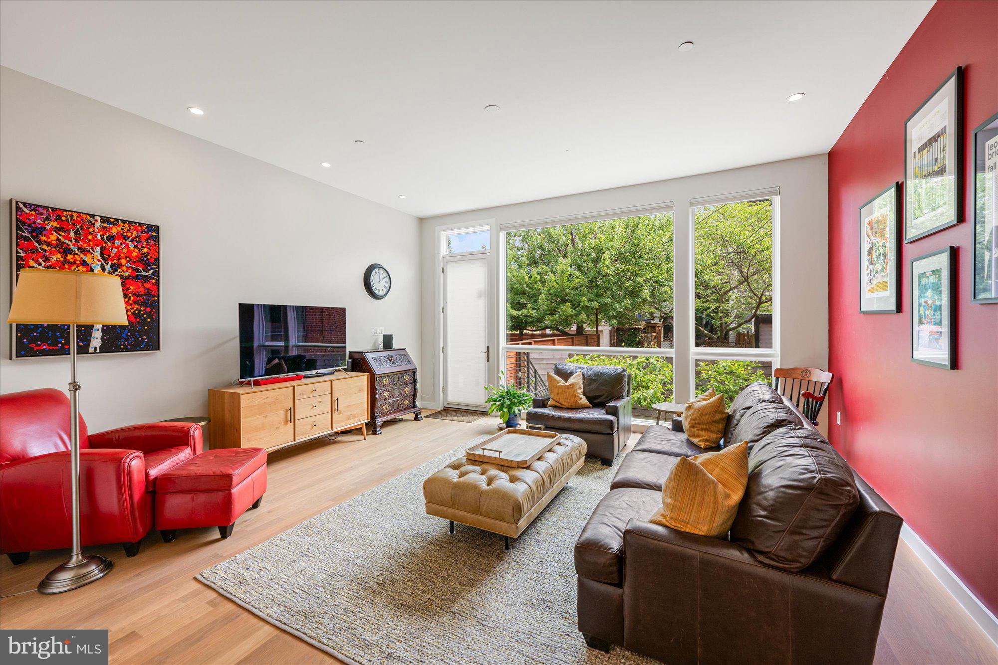 625 5th Street Northeast, Unit 1 Washington, DC 20002 - Photo 4 of 15 a living room with furniture and a flat screen tv