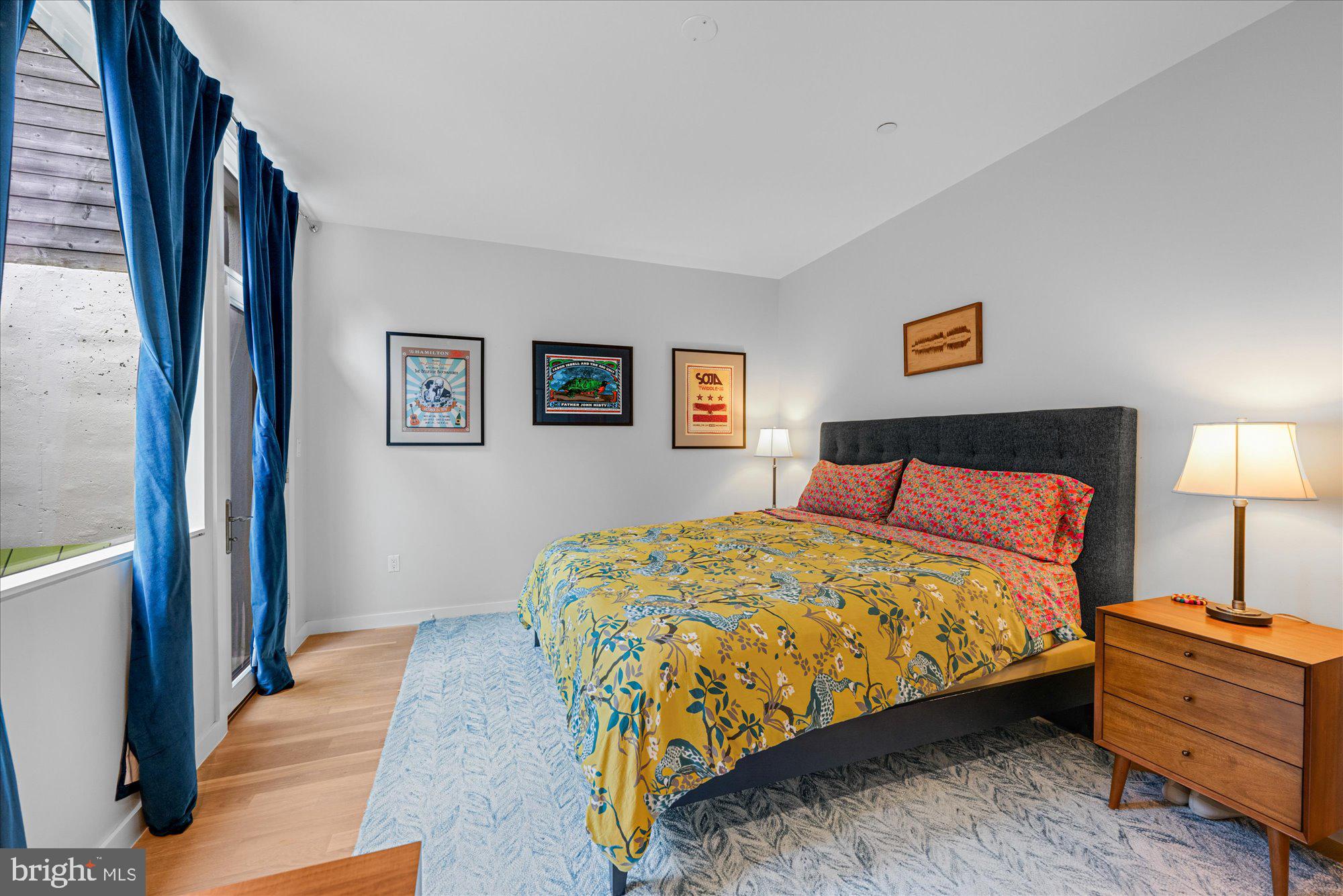 625 5th Street Northeast, Unit 1 Washington, DC 20002 - Photo 8 of 15 a bedroom with a bed and a night stand