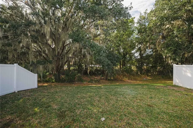 a view of outdoor space with deck and yard