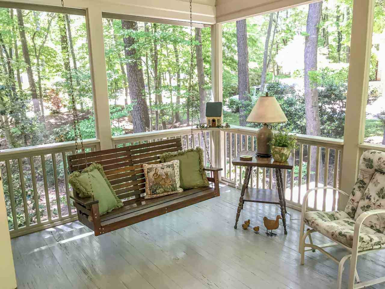 1806 Grande Oaks Road Durham, NC 27712 - Photo 12 of 25 Incredible Screened Porch with vaulted bead board ceiling and overhead fan offers a quiet place to enjoy the lush outdoor and garden views. Screened Porch