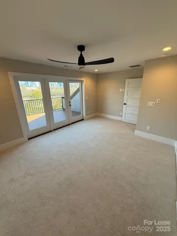 a view of an empty room with windows