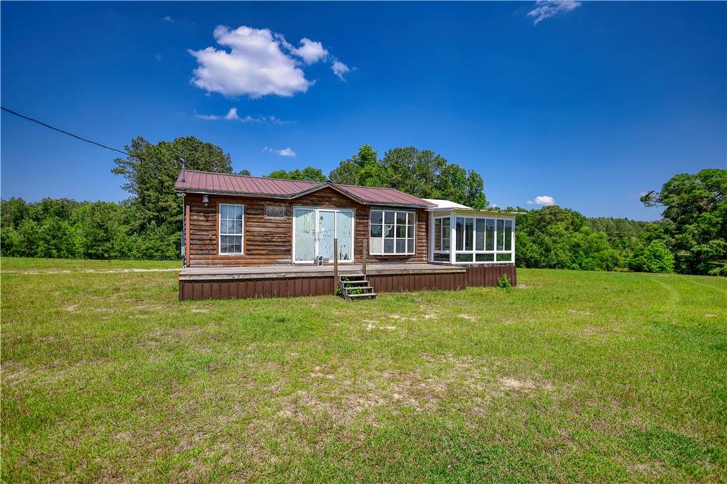 947 Bellhouse Road Macon, GA 31217 - Photo 115 of 132 a front view of a house with a garden