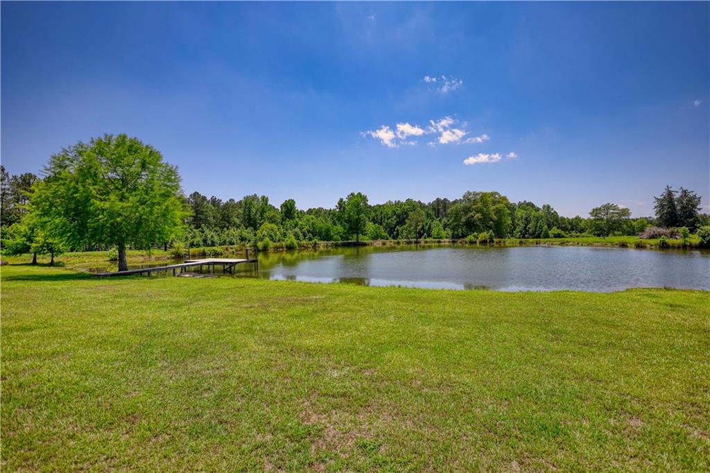 947 Bellhouse Road Macon, GA 31217 - Photo 77 of 132 a view of a lake with houses in the back