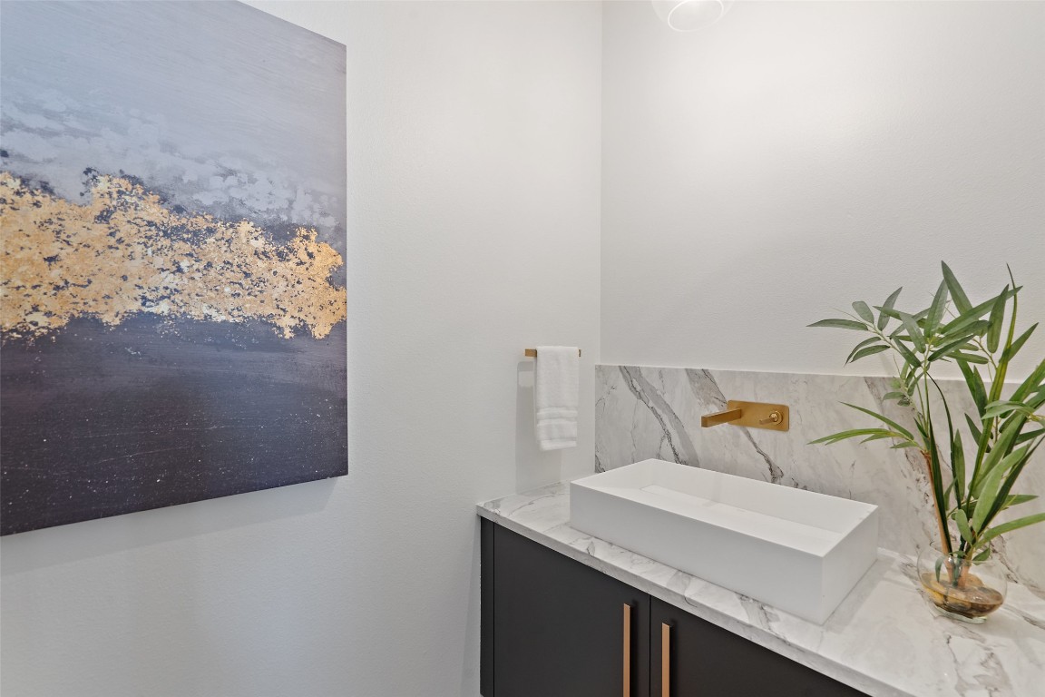 1203 Richcreek Road Austin, TX 78757 - Photo 23 of 28 a view of bathroom with a sink and a mirror