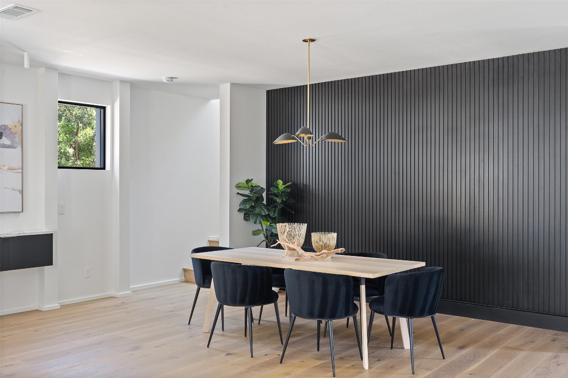 1203 Richcreek Road Austin, TX 78757 - Photo 9 of 28 a dining room with furniture and wooden floor
