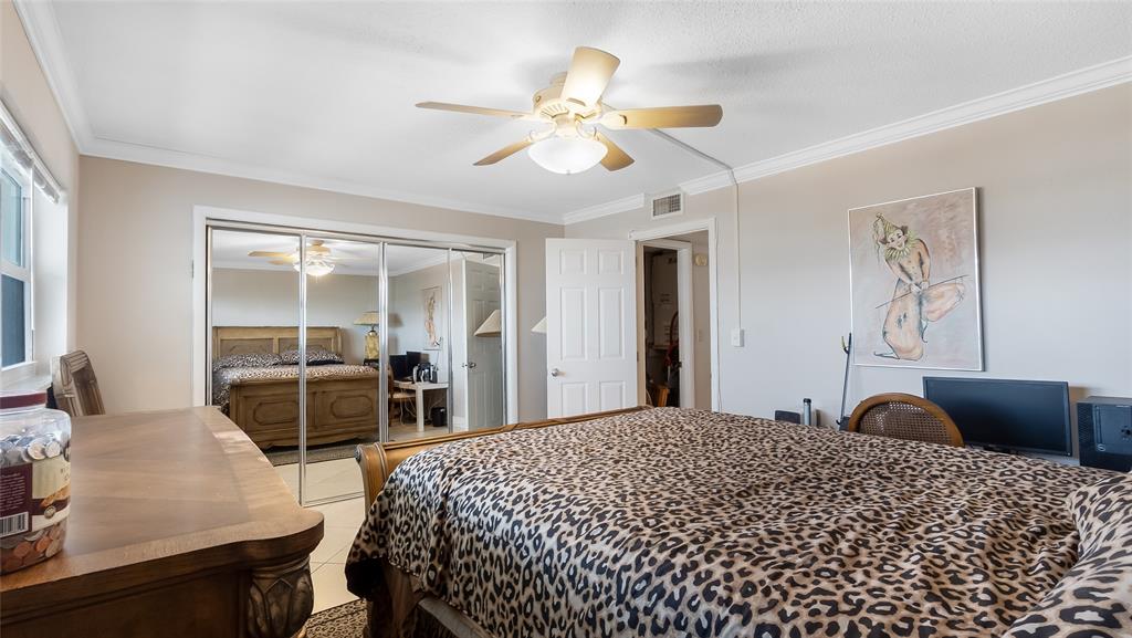 1169 Hillsboro Mile, Unit 717 Hillsboro Beach, FL 33062 - Photo 14 of 37 a bedroom with a bed and wooden floor