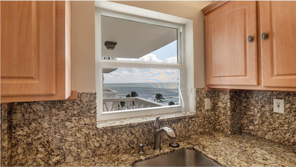 1169 Hillsboro Mile, Unit 717 Hillsboro Beach, FL 33062 - Photo 26 of 37 a bathroom with a window and a sink