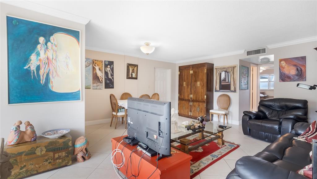 1169 Hillsboro Mile, Unit 717 Hillsboro Beach, FL 33062 - Photo 29 of 37 a living room with furniture and wooden floor