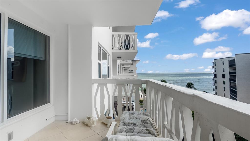 1169 Hillsboro Mile, Unit 717 Hillsboro Beach, FL 33062 - Photo 3 of 37 a view of a hallway with staircase