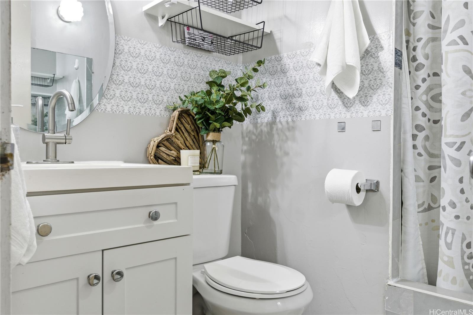 94-249 Waikele Road, Unit B313 Waipahu, HI 96797 - Photo 3 of 13 a bathroom with a sink a toilet and shower