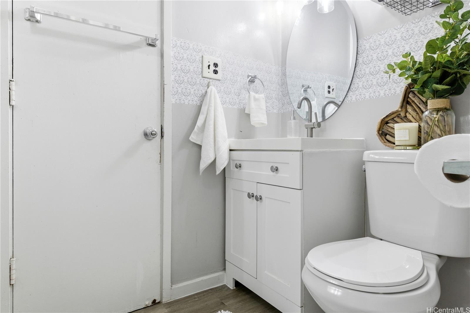 94-249 Waikele Road, Unit B313 Waipahu, HI 96797 - Photo 5 of 13 a bathroom with a toilet and a sink