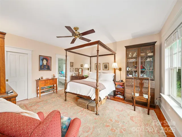 a bedroom with furniture and a window