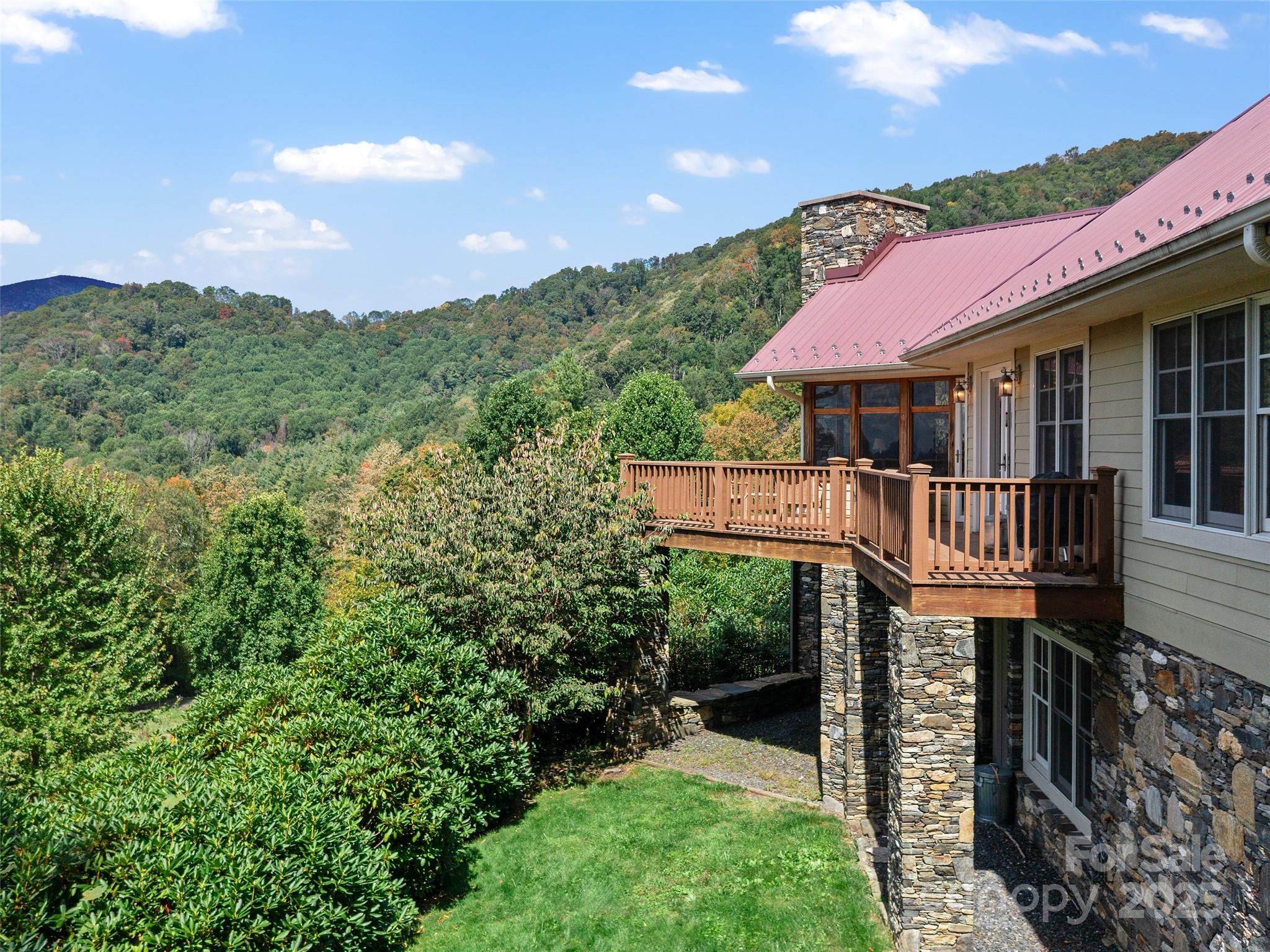 1992 Green Creek Road Bakersville, NC 28705 - Photo 22 of 48 a front view of a house with yard and mountain view