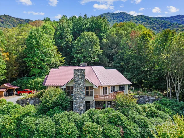 an aerial view of a house with a garden