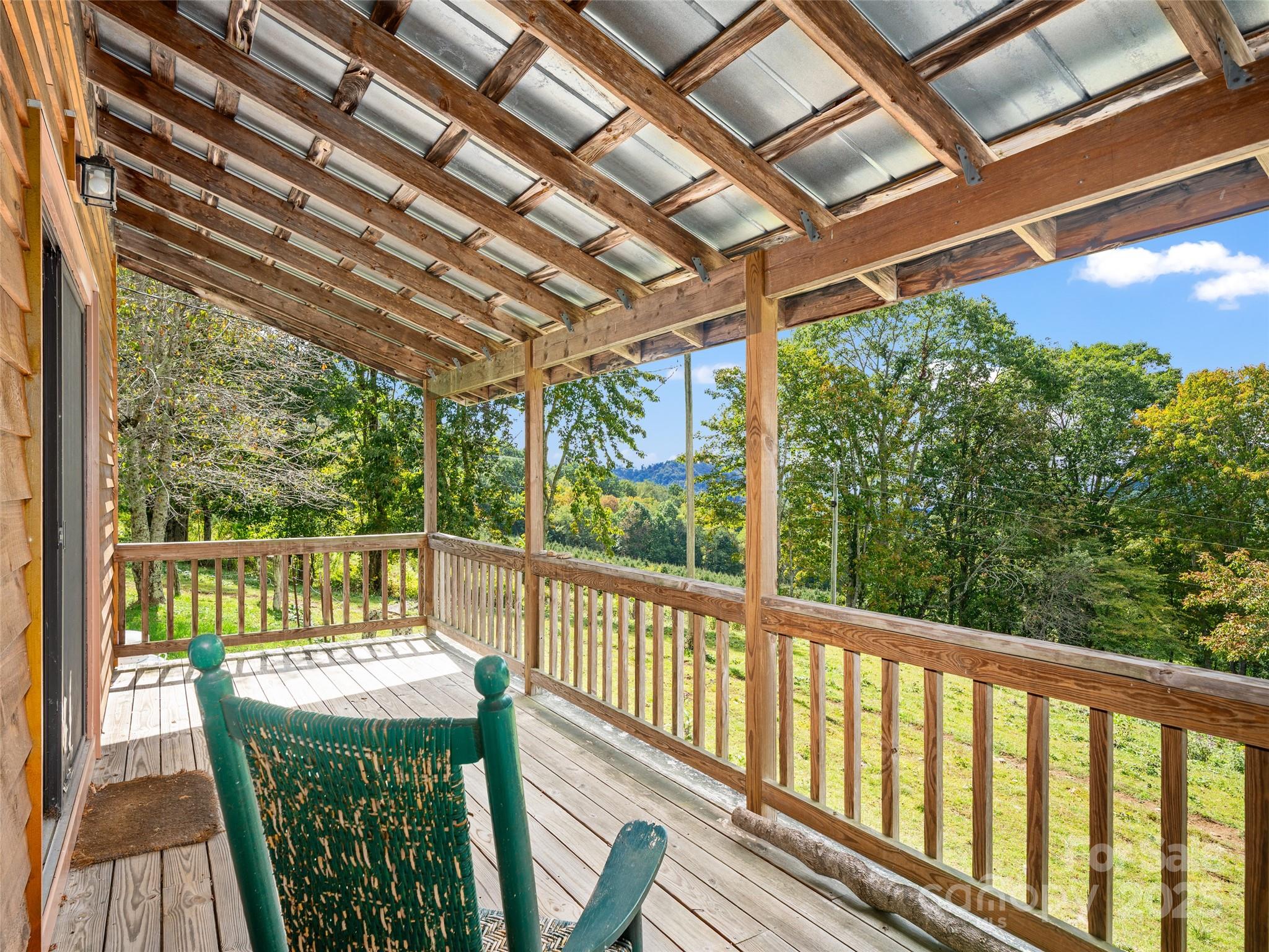 1992 Green Creek Road Bakersville, NC 28705 - Photo 28 of 48 a view of a two chair in the balcony