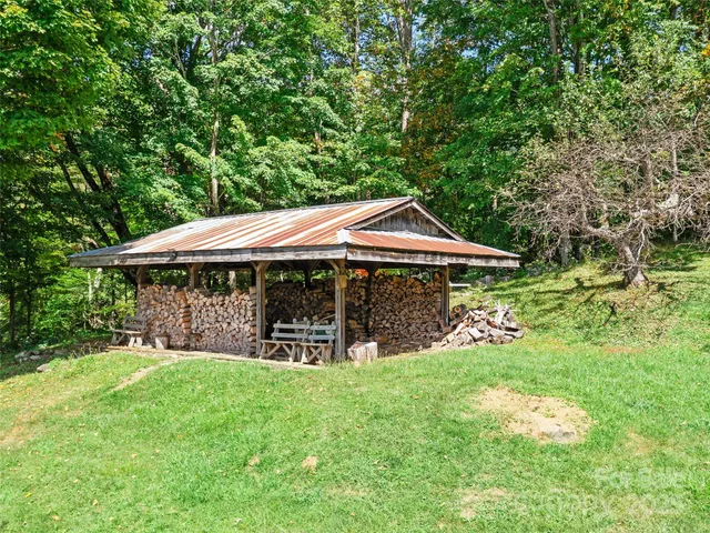 a couple of table and chairs under an umbrella