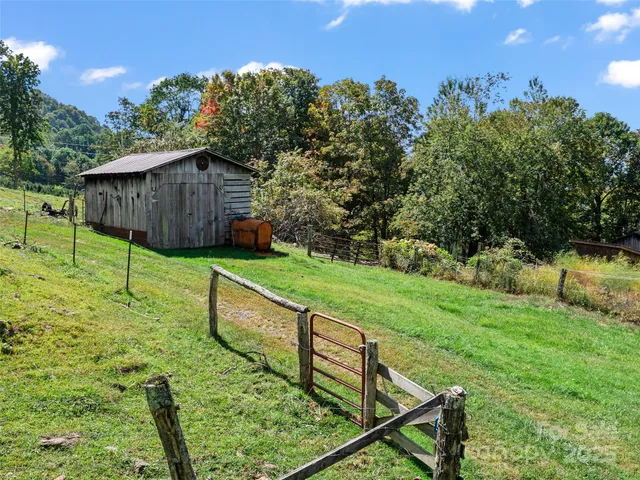 a view of an house with backyard space and garden