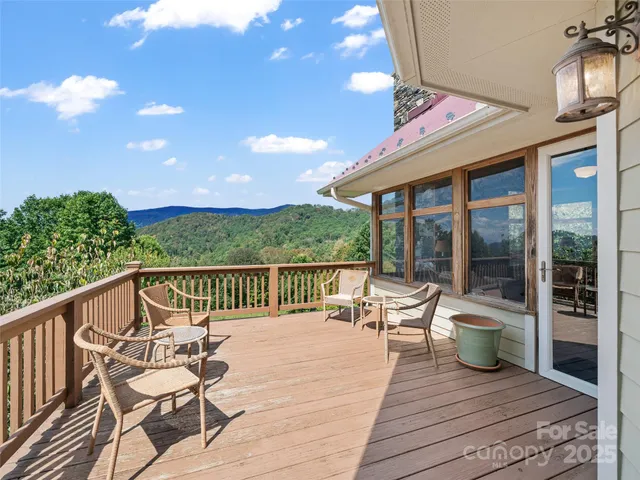 a view of a chairs and tables on the deck