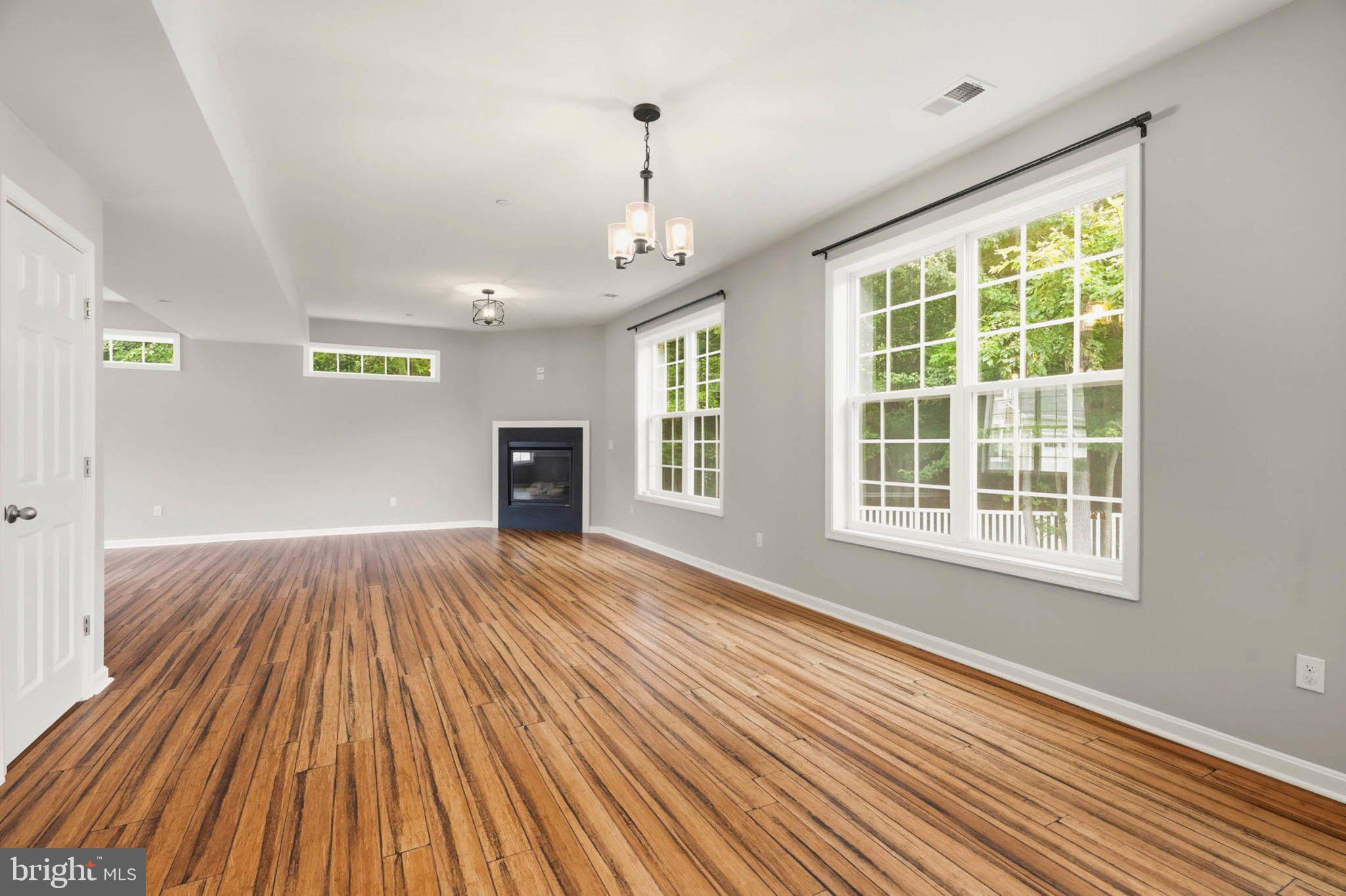 706 Trapper Way Deale, MD 20751 - Photo 8 of 61 Spacious room with elegant lighting.