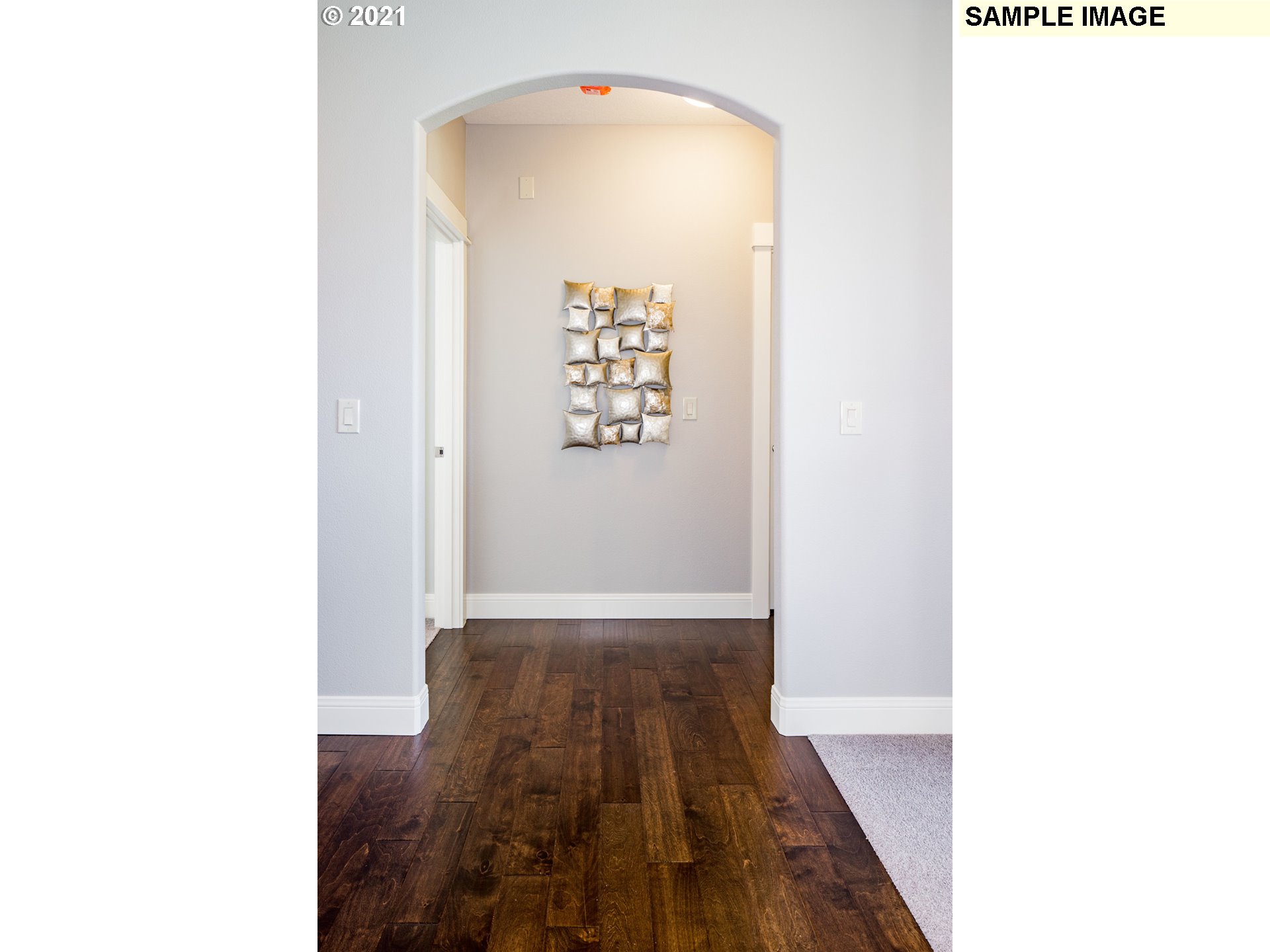 2938 South Cherry Grove Way Ridgefield, WA 98642 - Photo 11 of 20 a view of a hallway with wooden floor
