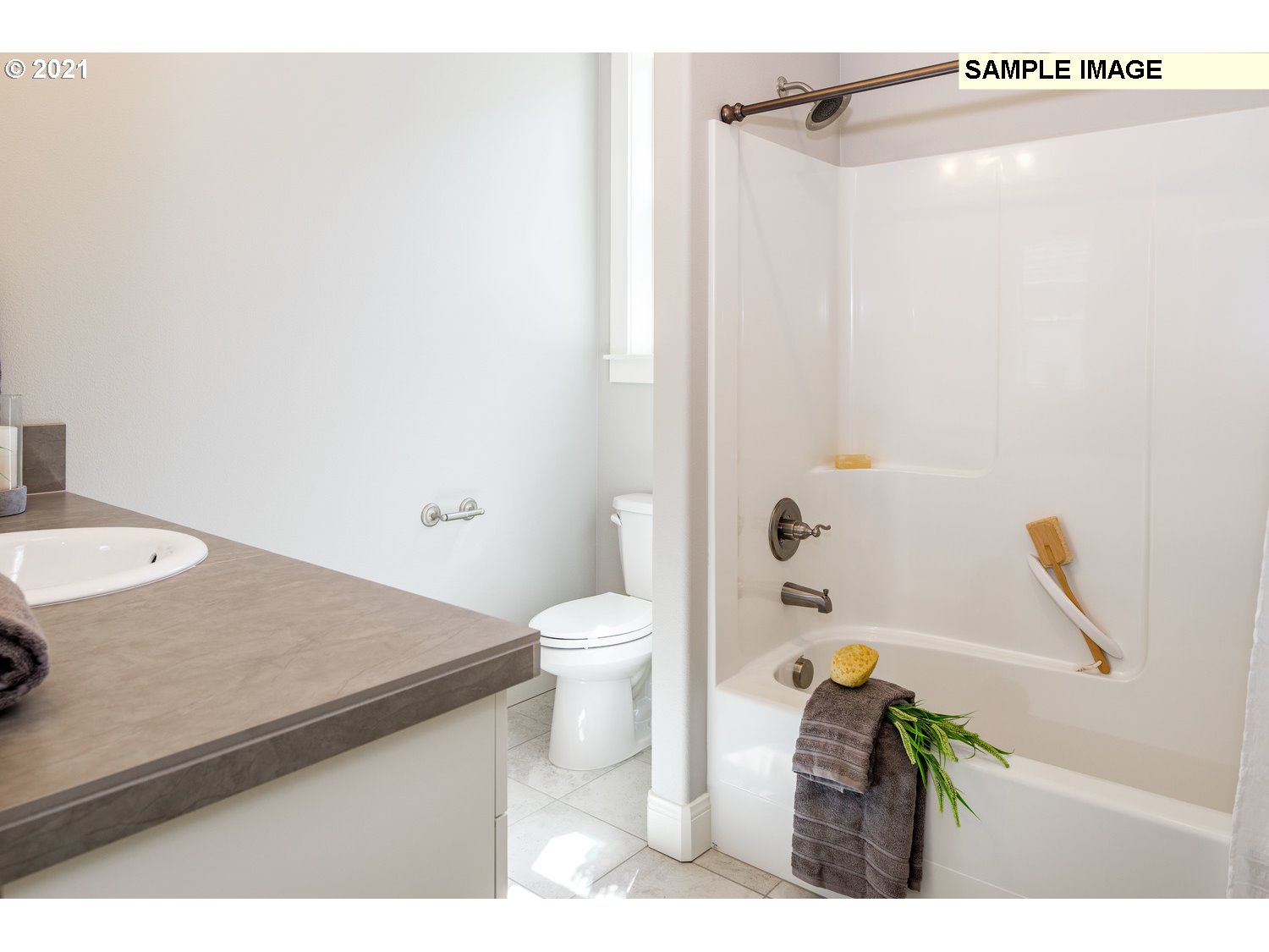 2938 South Cherry Grove Way Ridgefield, WA 98642 - Photo 14 of 20 a bathroom with a sink a toilet and shower