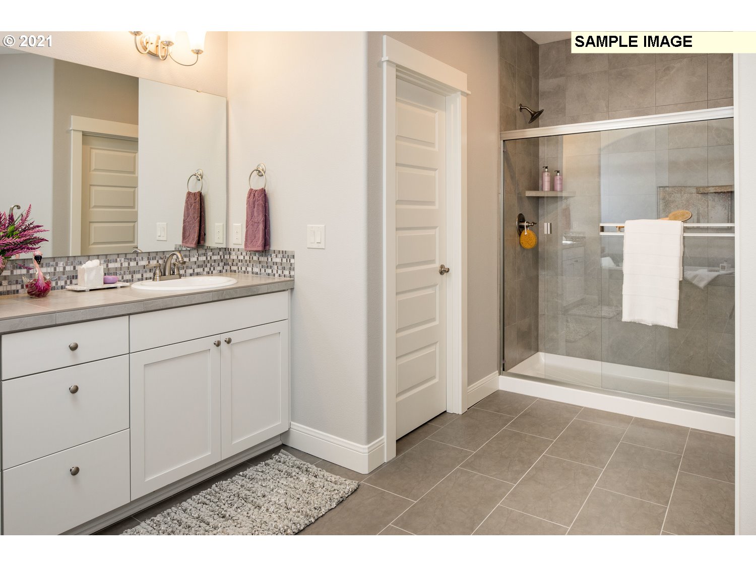 2938 South Cherry Grove Way Ridgefield, WA 98642 - Photo 19 of 20 a bathroom with a shower sink and mirror