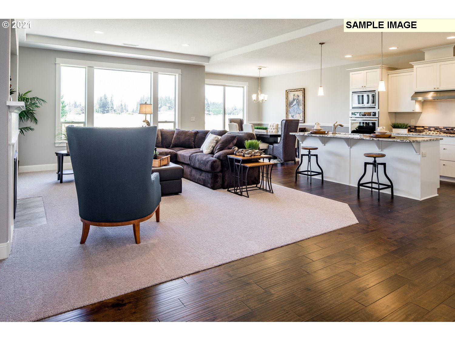 2938 South Cherry Grove Way Ridgefield, WA 98642 - Photo 6 of 20 a living room with furniture potted plant kitchen view and a window