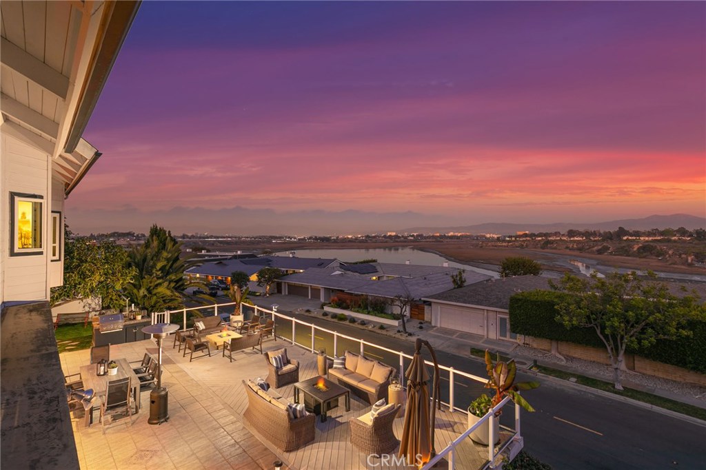 an aerial view of a house with a ocean view