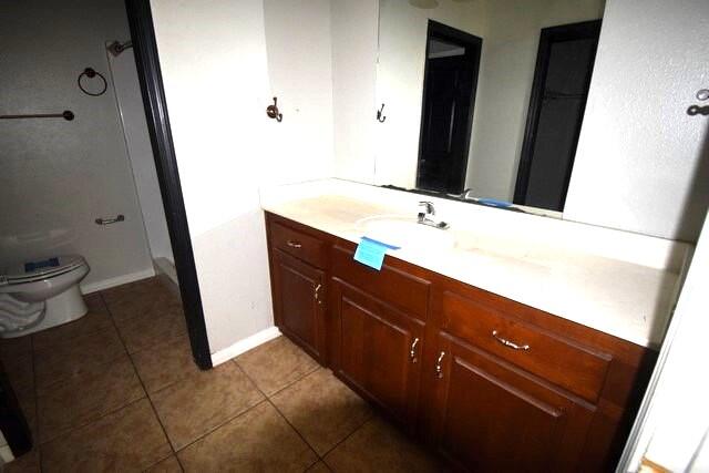 4052 Randi Road Crestview, FL 32539 - Photo 20 of 27 a bathroom with a sink a toilet and mirror