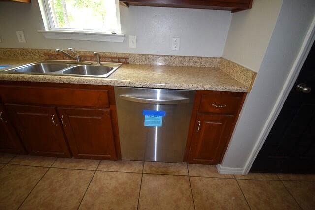 4052 Randi Road Crestview, FL 32539 - Photo 9 of 27 a kitchen with a sink a stove and cabinets