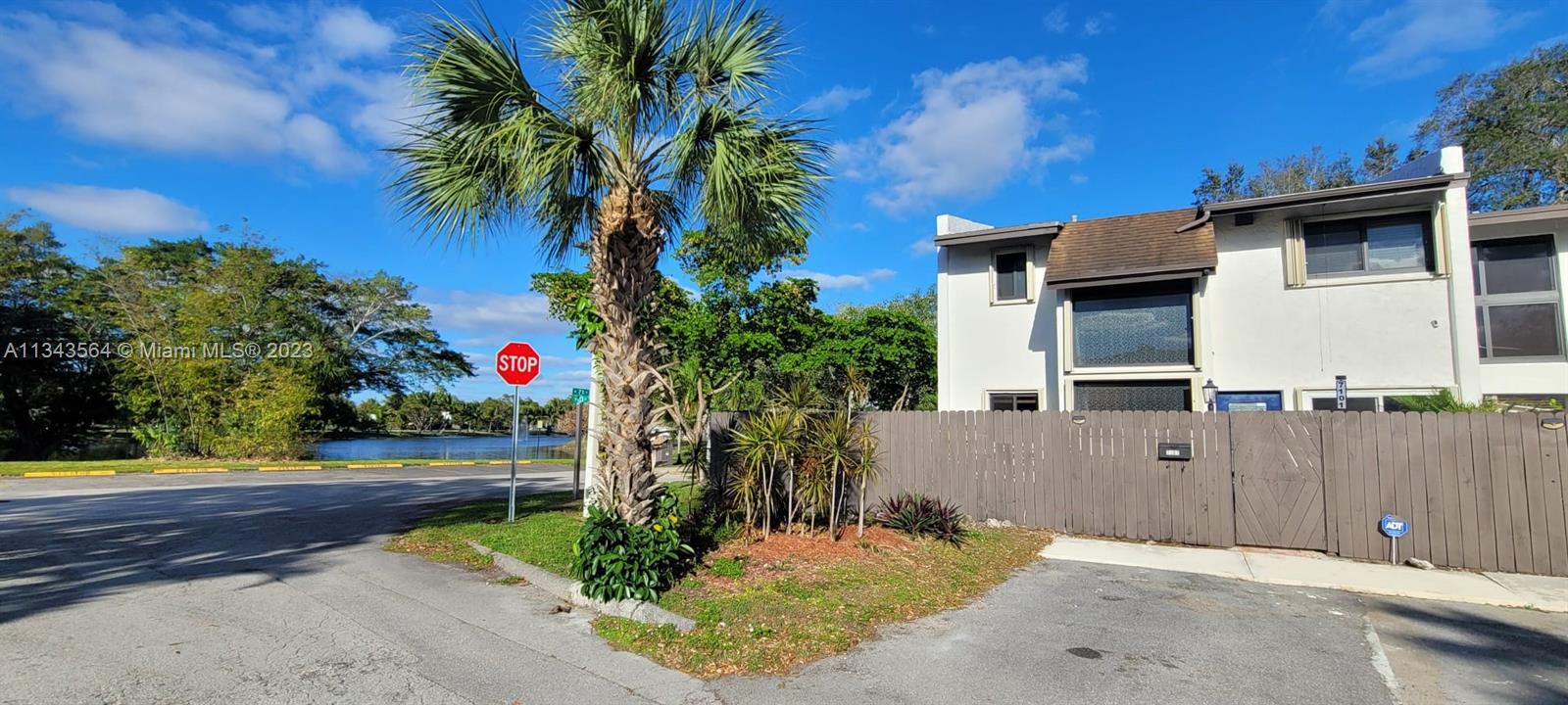 Snapper Creek Townhouses Miami, FL 33173 - Photo 2 of 22 a front view of a house with a yard