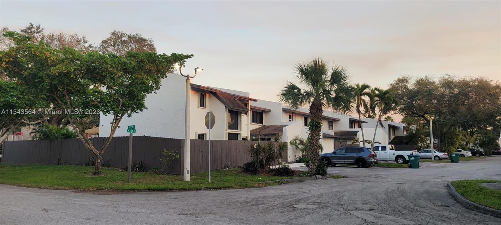 Snapper Creek Townhouses Miami, FL 33173 - Photo 3 of 22 a city street lined with buildings and trees