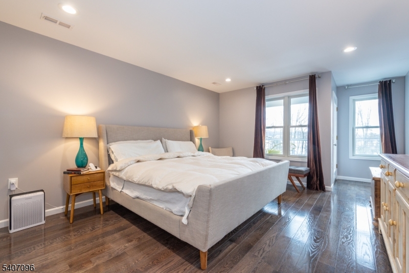 165 Lakeside Road, Unit 6 West Milford, NJ 07421 - Photo 11 of 23 a spacious bedroom with a bed and a lamp