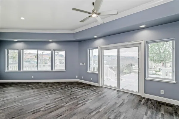 a bathroom with a granite countertop toilet sink and mirror