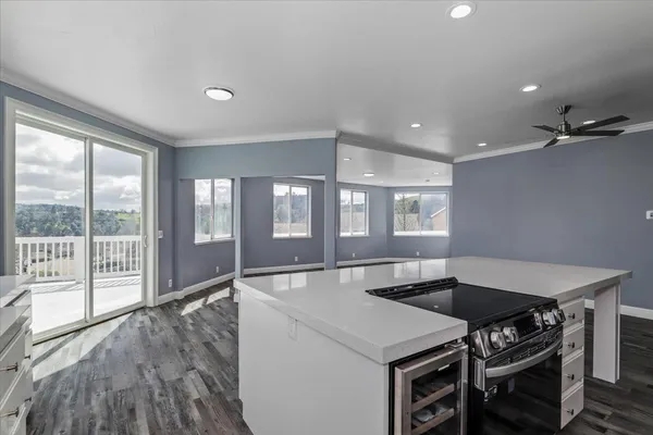 a front view of a house with a garden and garage