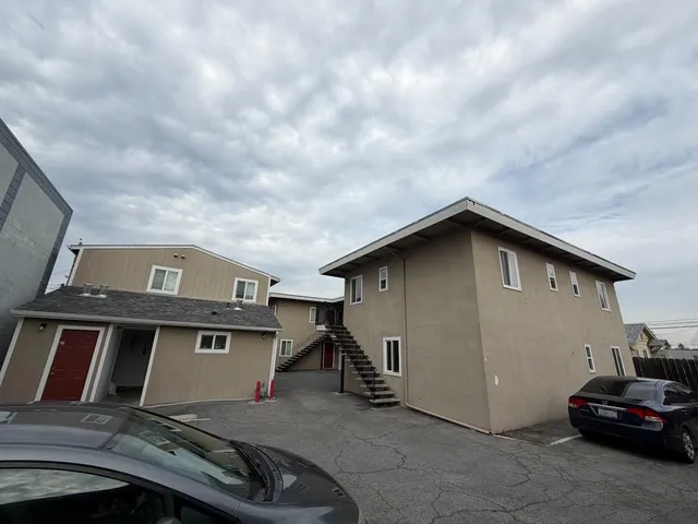a view of a car parked in front of a house
