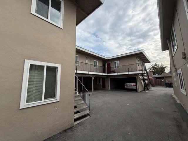 a view of a house with a barbeque