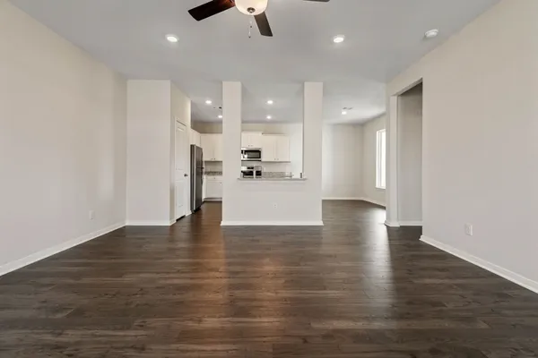 a view of kitchen with cabinets and wooden floor