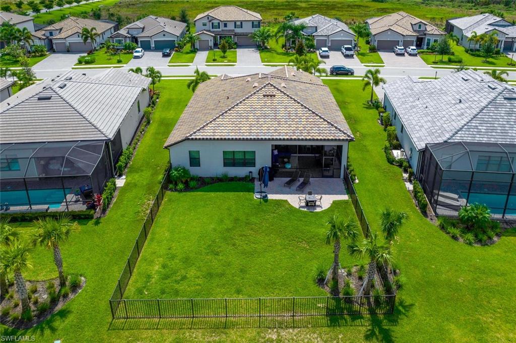 19809 Beechcrest Place Estero, FL 33928 - Photo 2 of 33 an aerial view of a house with swimming pool garden and patio