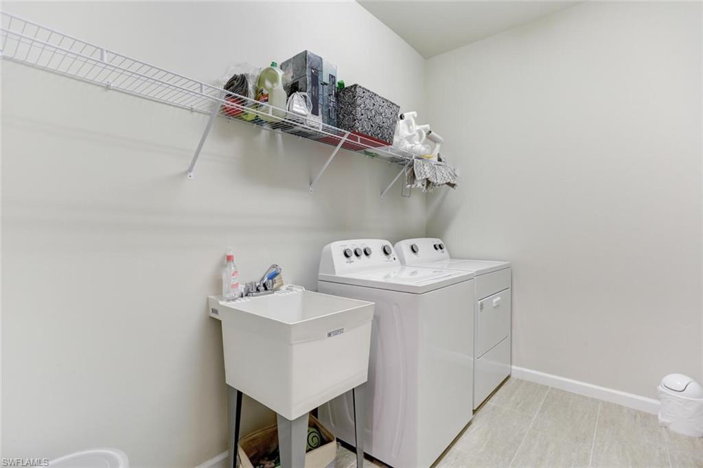 19809 Beechcrest Place Estero, FL 33928 - Photo 24 of 33 a utility room with dryer and washer