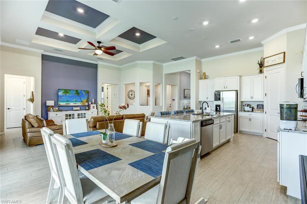 19809 Beechcrest Place Estero, FL 33928 - Photo 6 of 33 a view of a dining room with furniture