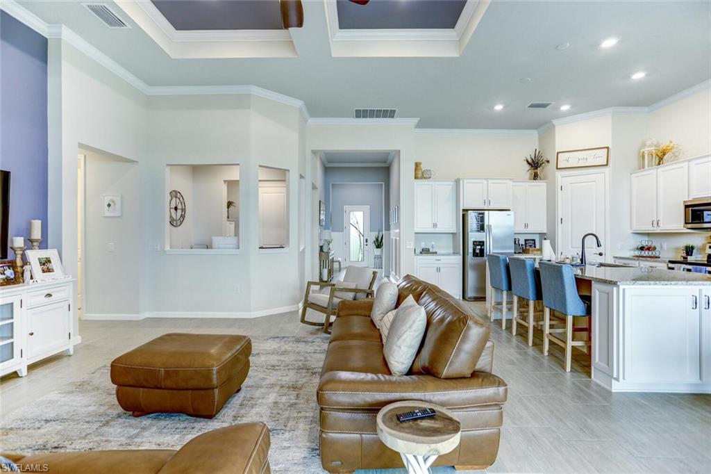 19809 Beechcrest Place Estero, FL 33928 - Photo 7 of 33 a living room with furniture and a wooden floor