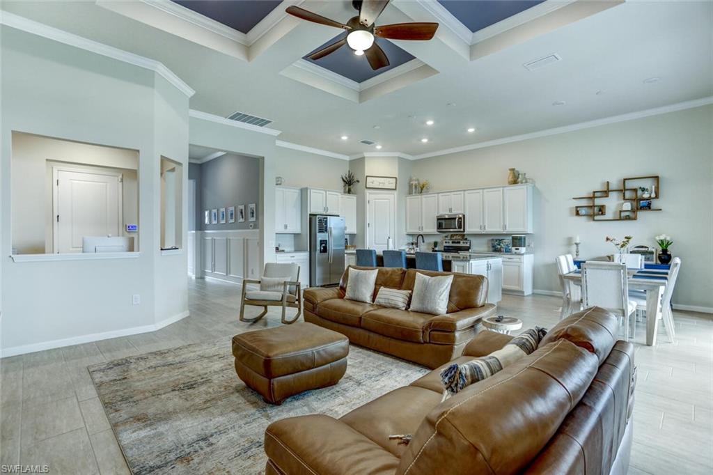 19809 Beechcrest Place Estero, FL 33928 - Photo 8 of 33 a living room with furniture and a view of kitchen