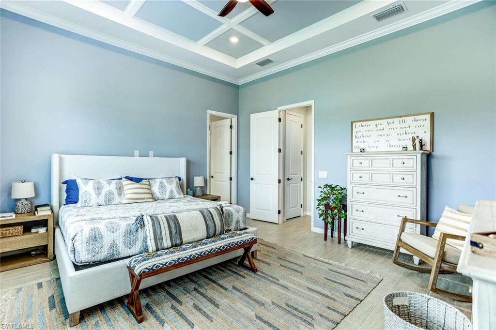 19809 Beechcrest Place Estero, FL 33928 - Photo 10 of 33 a bedroom with furniture and a wooden floor