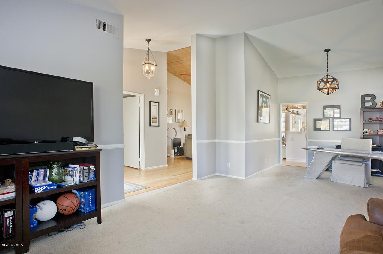 3560 Radcliffe Road Thousand Oaks, CA 91360 - Photo 5 of 26 a living room with furniture a flat screen tv and a refrigerator