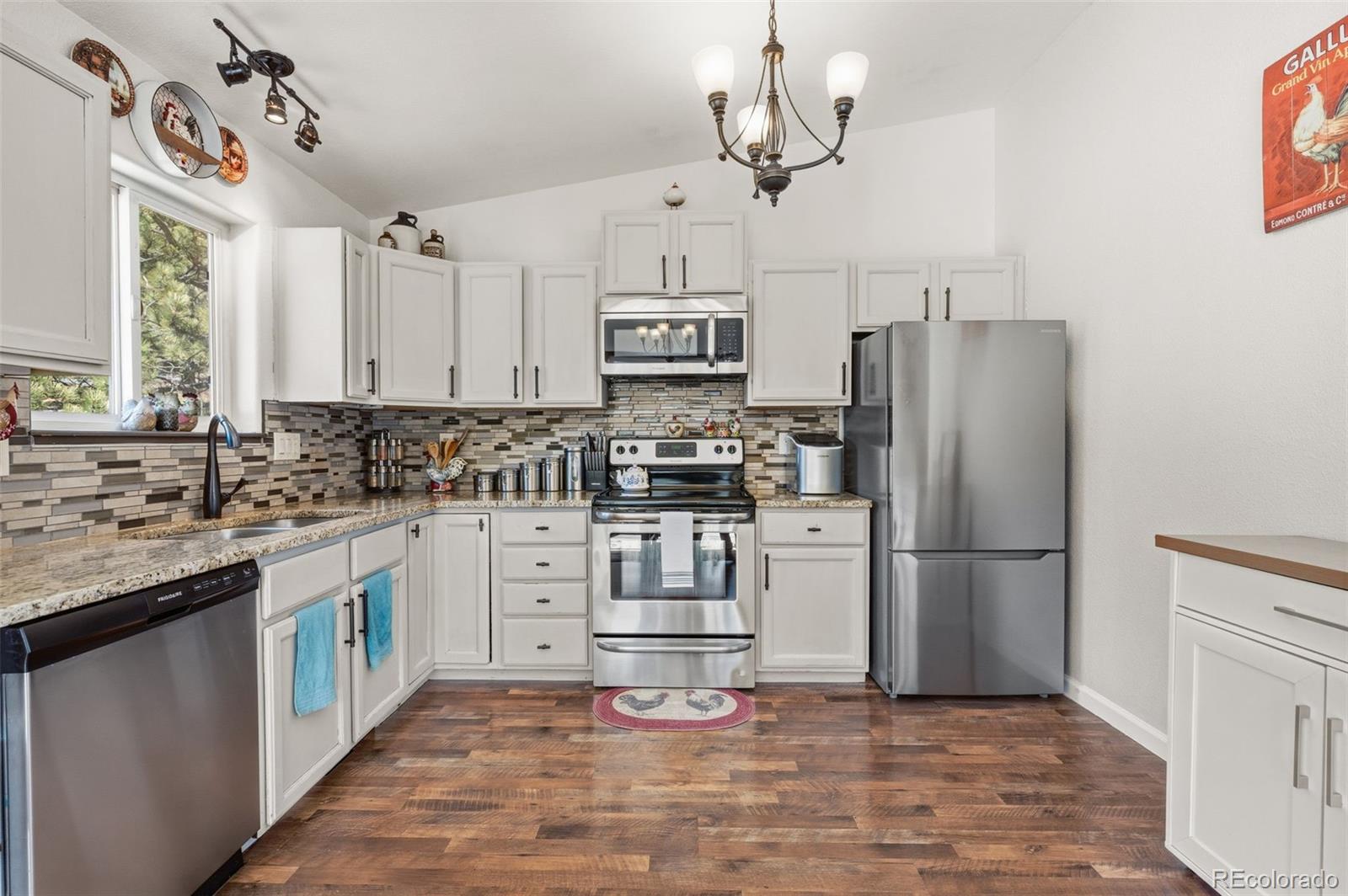 2222 County Road 72 Bailey, CO 80421 - Photo 18 of 50 a kitchen with stainless steel appliances a refrigerator sink and microwave
