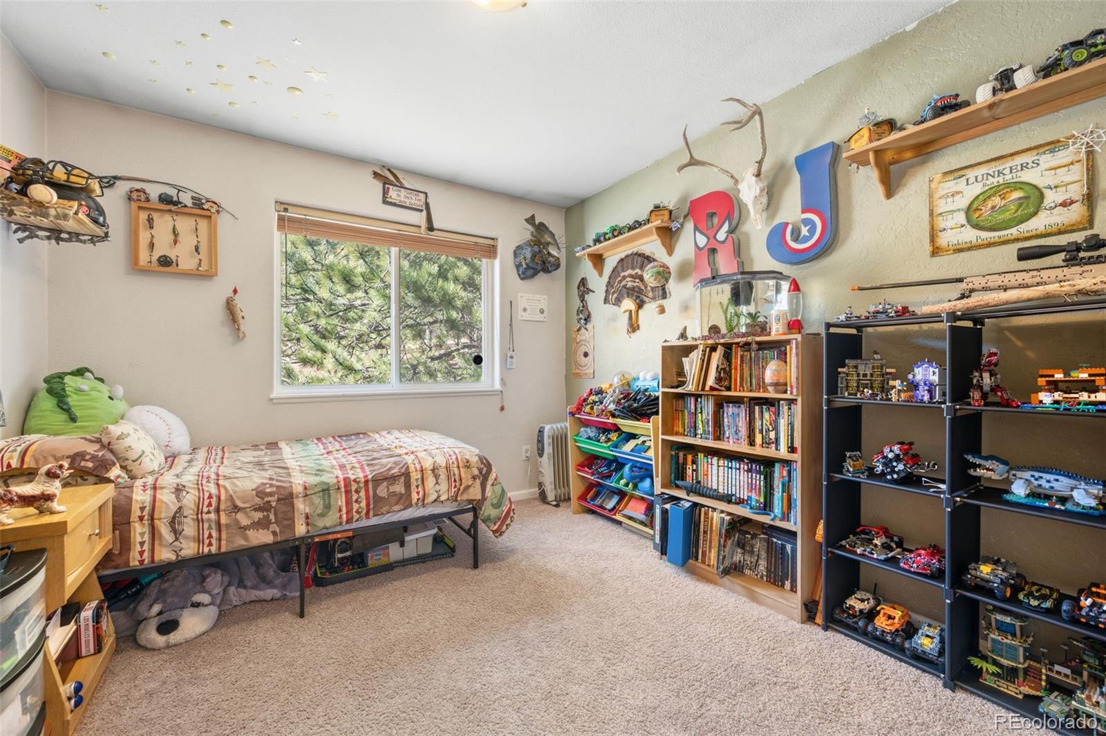 2222 County Road 72 Bailey, CO 80421 - Photo 23 of 50 a bed room with a bed and a window