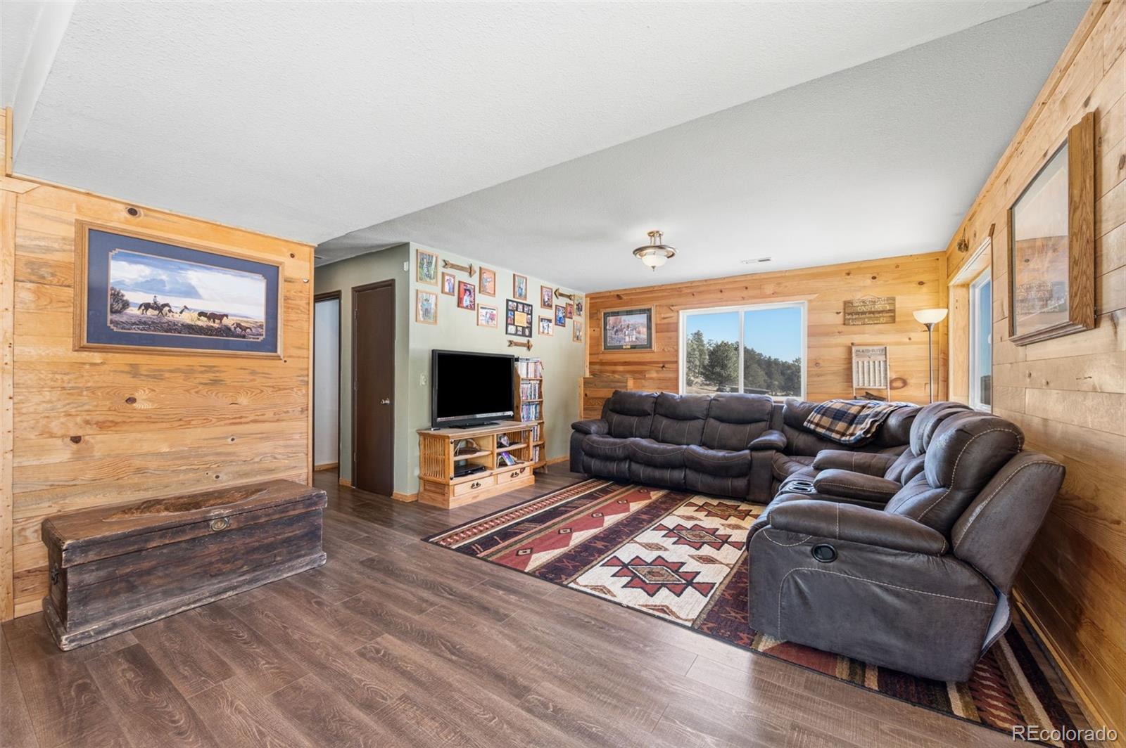 2222 County Road 72 Bailey, CO 80421 - Photo 27 of 50 a living room with furniture and a flat screen tv